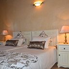 Bedroom with two single beds pushed together.